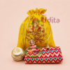 Lakshmi print potli return gift combo featuring a pure brass Om kumkum box, premium cotton blouse piece