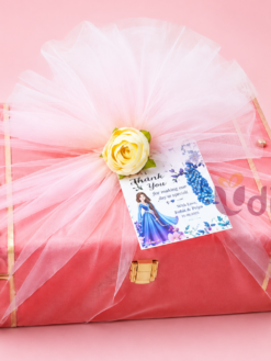 Indo-Western Half Saree Ceremony trunk hamper with saree cover, potli bag, broad bangles, jhumkas, haldi kumkum, and customized thank you card.