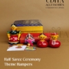 Korai box Half Saree ceremony return gift hamper with Kondapalli dolls, cotton blouse piece, Haldi Kumkum, and customized thank you card.