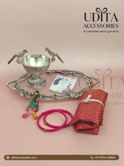German Silver tray hamper with bird bowl, brocade blouse piece, silk thread bangles, Haldi Kumkum, and thank you card for Half Saree ceremony return gifts.