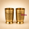 Premium brass tumbler with intricate peacock engraved design for drinking water, pooja rituals, wedding return gifts, and traditional home decor.