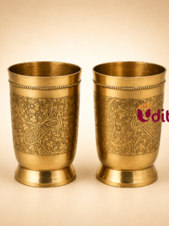 Premium brass tumbler with intricate peacock engraved design for drinking water, pooja rituals, wedding return gifts, and traditional home decor.