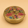 Decorative brass masala box with multicolor peacock artwork and 7 removable brass spice containers, ideal for spice storage, kitchen décor, housewarming gifts, wedding return gifts, and festive gifting.