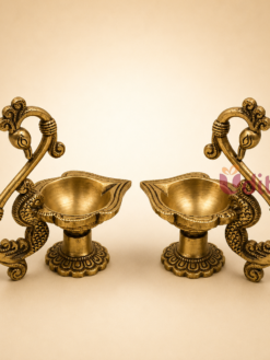 Premium handcrafted Brass Peacock Diya Pair with decorative peacock design for pooja, Diwali, temple rituals, wedding return gifts, and traditional home decor.