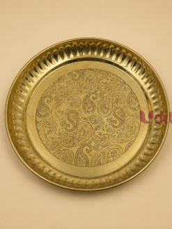 Premium 6-inch brass decorative plate featuring an intricate paisley engraved design and hammered border, perfect for pooja rituals, prasadam serving, home décor, and wedding return gifts.