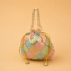 Designer pearl handle potli bag with embroidered geometric pattern and tassel drawstrings, premium return gift pouch for weddings, festive gifting, bridal occasions, and women, available in assorted colours.