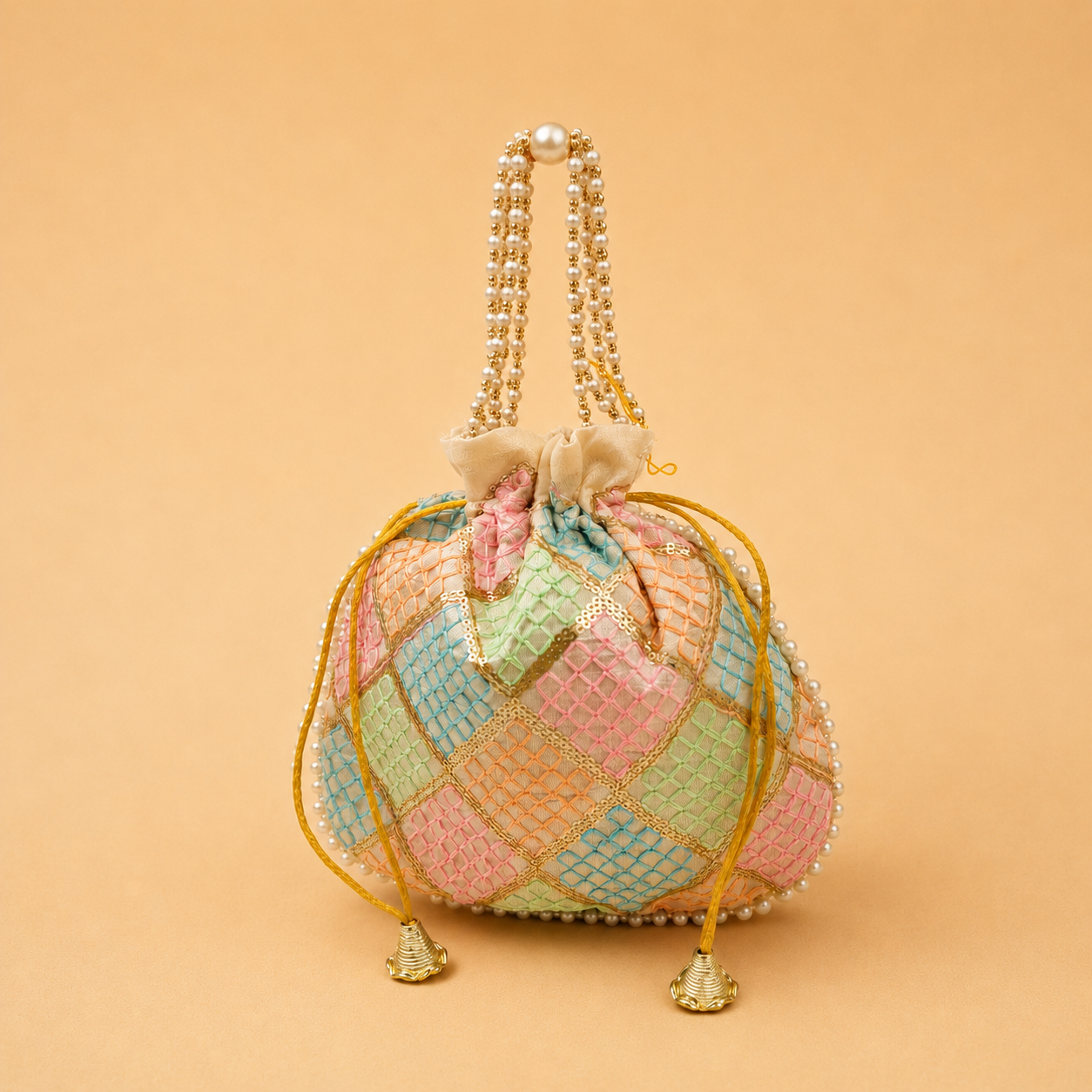 Designer Pearl Handle Potli Bag | Assorted Colours Designer pearl handle potli bag with embroidered geometric pattern and tassel drawstrings, premium return gift pouch for weddings, festive gifting, bridal occasions, and women, available in assorted colours.