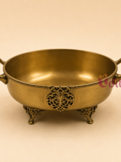 Premium brass serving bowl with decorative handles and antique finish, suitable for dry fruits, sweets, floating flowers, home décor, wedding return gifts, and housewarming gifts.