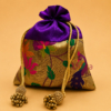 Premium Paithani silk potli bag with traditional zari weaving, decorative tassel drawstrings, reusable return gift pouch for weddings, festive gifting, and women, available in assorted colours.
