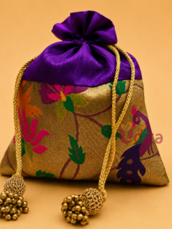 Premium Paithani silk potli bag with traditional zari weaving, decorative tassel drawstrings, reusable return gift pouch for weddings, festive gifting, and women, available in assorted colours.