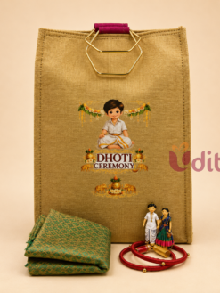 Designer Dhoti Ceremony return gift combo featuring a customized jute bag, brocade cloth, silk thread bangles, Lotus Haldi Kumkum, and traditional figurine.