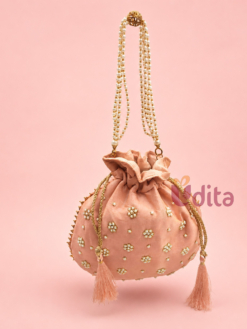 Designer embroidered potli bag with pearl handle and tassel drawstrings, premium return gift bag for weddings, festive gifting, women, and bridal occasions, available in assorted colours.