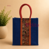 Premium Kalamkari jute bag with braided rope handles, eco-friendly reusable return gift bag featuring traditional Kalamkari artwork, available in assorted colours for weddings, festivals, housewarming, and corporate gifting.