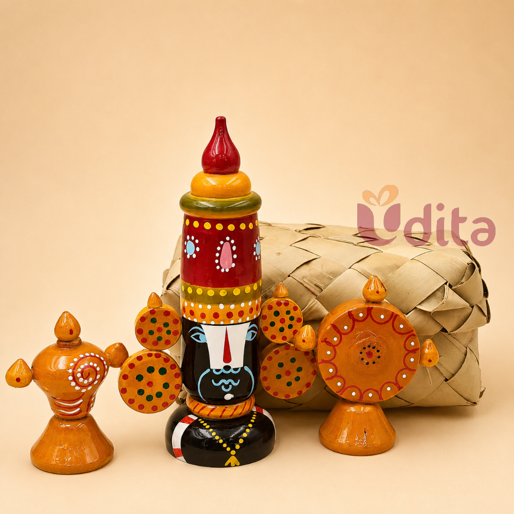 Premium traditional housewarming hamper featuring a Namam jute bag, handcrafted Kondapalli Balaji doll, and brass Shanku Chakra diyas.