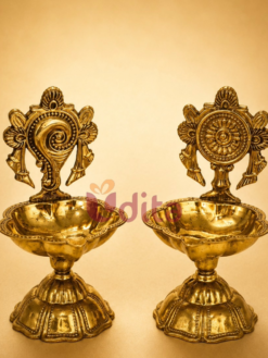 Traditional brass Shanku and Chakra diya set for pooja, temple decor, Diwali, wedding return gifts, and spiritual gifting.