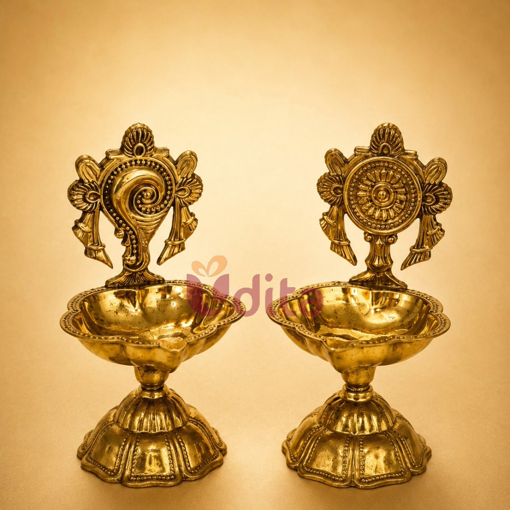 Traditional brass Shanku and Chakra diya set for pooja, temple decor, Diwali, wedding return gifts, and spiritual gifting. Traditional brass Shanku and Chakra diya set for pooja, temple decor, Diwali, wedding return gifts, and spiritual gifting.