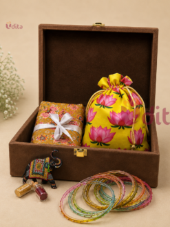 Varalakshmi Vratham gift box combo with lotus potli, cotton blouse piece, 12 glass bangles, and haldi kumkum for festive return gifts.
