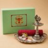 Housewarming Return Gift Hamper with German Silver Peacock Diya Stand, German Silver Acrylic Tray, Blouse Piece, Haldi Kumkum Set and Customized Gift Box