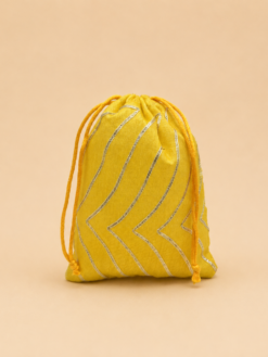 6 inch yellow potli bag with silver zari design